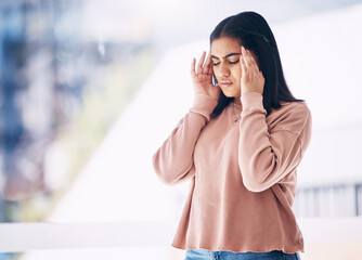 Headache, burnout or mockup with an indian woman on a blurred background suffering from pain or...