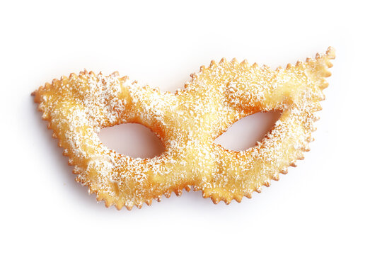 Traditional sweet crisp pastry deep-fried in shape of Carnival mask on white. Italian Chiacchere or crostoli, bugie, cenci 