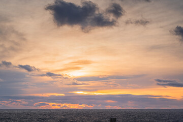 Sunset over the sea with clouds