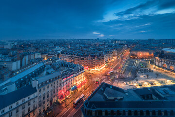 Aerial view of city skyline in Paris and Gare de Lyon at night