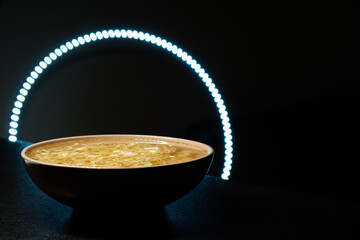 Noodles. restaurant design. Instant egg noodles on a black background on a plate. with led...