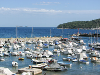 Dubrovnik, Croatia - Boats parked in a harbor on the Adriatic Sea in Dubrovnik on a sunny day with clear blue skies.  Image has copy space.