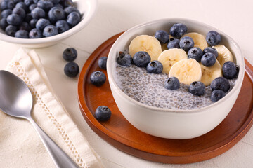 Fiber rich breakfast of chia pudding with fresh blueberries and banana