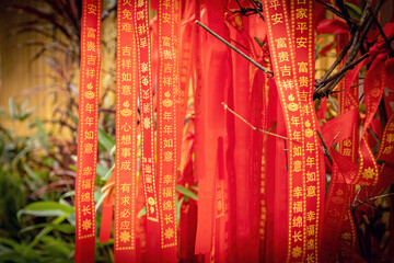 Red Mantra ribbons in Chinese temple