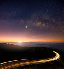 landscape view point asphalt curved road on Doi Inthanon National park mountains at dawn with milky way background.