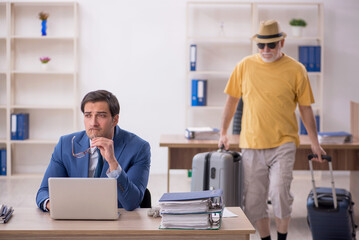 Old male boss and young male employee in summer vacation concept