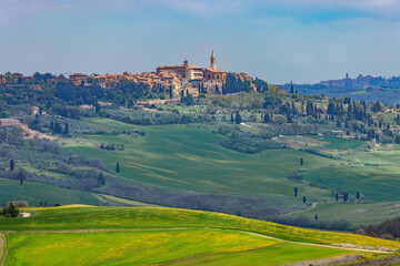 View towards Pienza on a hill in the Val d'Orcia in Tuscany, Italy.