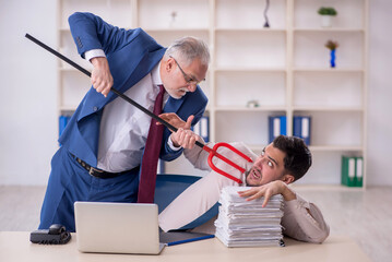 Old male boss and young male employee in bullying concept