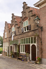 Fototapeta premium Old 17th century houses that were used as small shops at the time in the picturesque Dutch town of Oudewater.