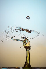 Water drop falling and colliding with another one	