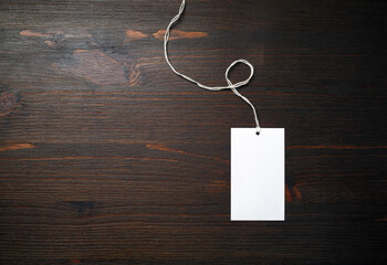 Blank price tag mockup on wood table background. Template for graphic designers portfolios. Flat...