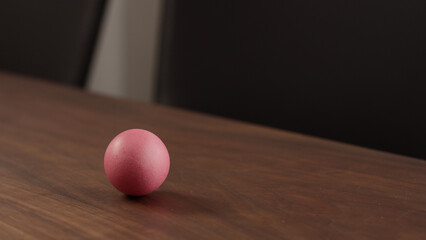 spinning easter egg on walnut table
