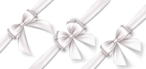 Set of satin decorative white bows with horizontal ribbon isolated on white background. Vector white bow and ribbon - 570609489