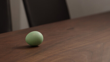 spinninng easter egg on walnut table
