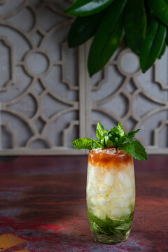 Queen's Park Swizzle cocktail garnished with mint