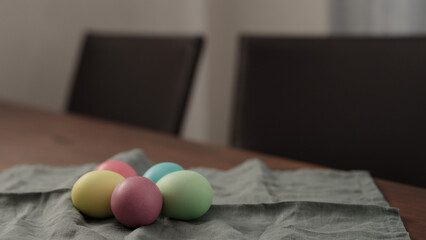 easter eggs on a linen cloth on walnut table