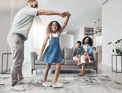 Happy Family, Dance And Music In A Living Room By Girl And Father Playing, Bonding And Happy In Their Home. Kids, Parents And Dancing Game In A Lounge On A Weekend, Cheerful And Happiness Together