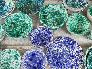 blue and green colored ceramic or clay plates