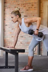 Fotobehang Sportschool Bodybuilder goal, dumbbell focus and woman in gym for training, sports and exercise wellness. Thinking, sport strong and athlete with weights for fitness and health workout performance for muscle  © Joanrae P/peopleimages.com