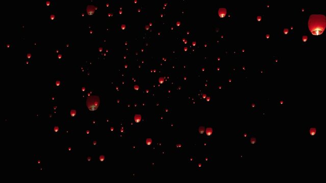 Lanterns isolated on transparent background. Floating lanterns in the sky. Flying Chinese Lanterns. flying lantern lights with flame at night sky.