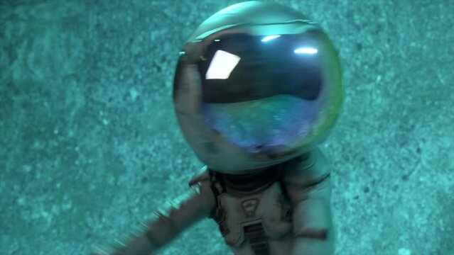 Dancing astronaut with a large round helmet on his head. Green blue neon light blinking. Concrete wall in the background