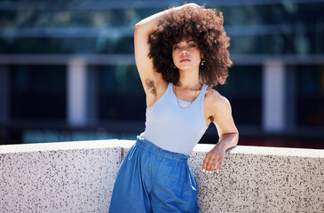 Portrait, fashion and armpit hair with a black woman in the city on a bridge, looking relaxed...
