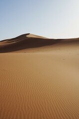 Fototapeta na wymiar Field of Erg Chigaga dune in Sahara desert in MOROCCO - vertical