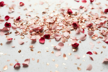 Rose Petal Background - Dusty pink rose petals and gold flitters against a pure white backdrop - Generative AI technology