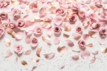 Rose Petal Background - Dusty pink rose petals and gold flitters against a pure white backdrop - Generative AI technology