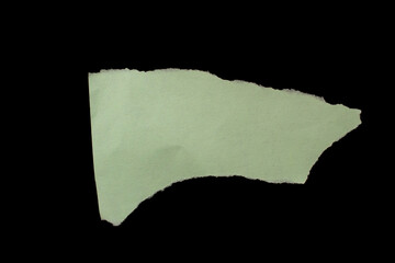 Torn paper piece isolated on black background
