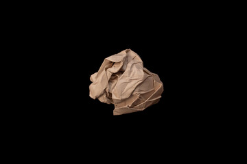 Crumpled paper ball on black background