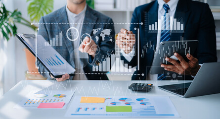 Team colleagues wear formal attire to work together to optimize business processes by using new technologies. high tech hologram in office background.