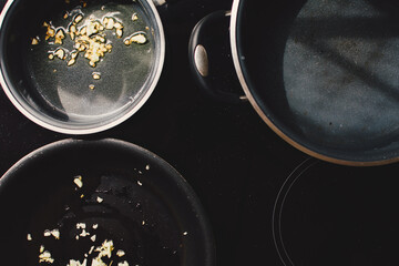 Frying garlic in frying pan, cooking at home, top view