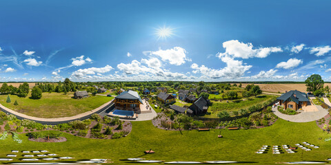 aerial full seamless spherical hdri 360 panorama view above green village with private development...