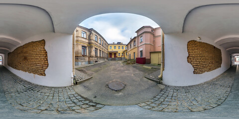 full seamless spherical hdri 360 panorama near old houses in narrow courtyard or backyard with...
