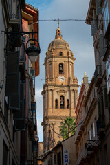 Fototapeta na wymiar Málaga Cathedral from the point of view of a street coming from Calle Larios.