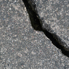 Old aged weathered cracked grey black tarmac texture pattern, large detailed damaged textured asphalt grungy background flat lay, vertical rough grained broken pattern macro closeup grunge copy space