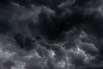 dark clouds black sky in overcast. Heavy rain thunderstorm black wave swirl smoke cloud. Pattern of...