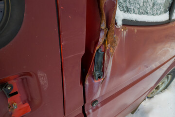 Close-up of a mangled car door.