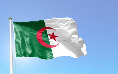 Naklejka na ściany i meble National flag of algeria independence day 5th july symbol of Islam light blue clear sky 