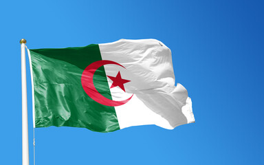 Naklejka na ściany i meble National flag of algeria independence day 5th july symbol of Islam blue sky background 