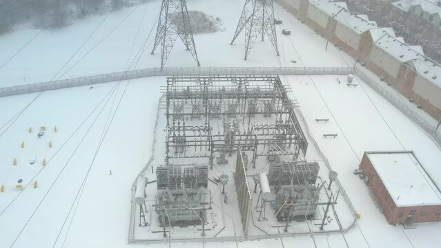 Electrical grid infrastructure development for the high electricity demand due growing amount of EV and electric vehicles. Power lines transfer energy and distribution for charging stations.