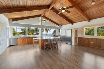 Vacant empty Interior wood beam tongue and groove ceiling and floors.