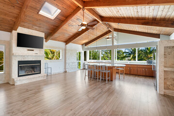 Vacant empty Interior wood beam tongue and groove ceiling and floors.