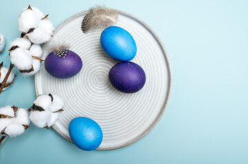 Multi colored Easter eggs and cotton flower