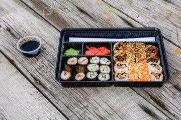 Set of the different sushi on wooden table