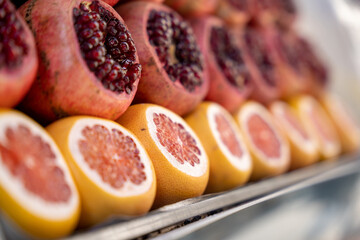 Market Cut Red Fresh Pomegranates and Grapefruits