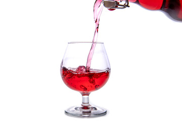 moving a glass of red wine on a white background