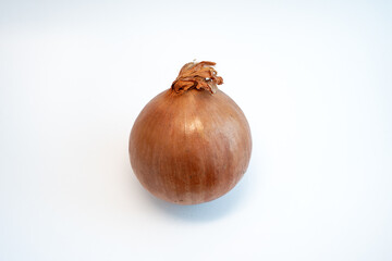 One yellow onion isolated on white background. Healthy vegetable used in cooking.