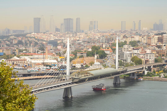 Aerial view of Golden Horn Metro Bridge, or Halic Metro Koprusu, before sunset, Istanbul city, Turkey